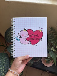 Libreta "Love Sucks"