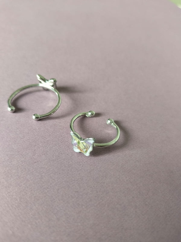 Anillo ajustable con flores mariposa plateado