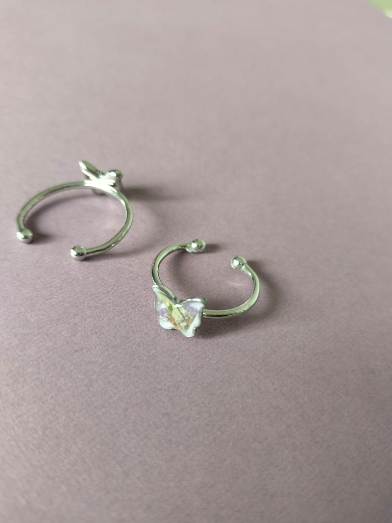 Anillo ajustable con flores mariposa plateado